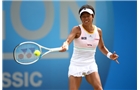 BIRMINGHAM, ENGLAND - JUNE 13:  Kimiko Date-Krumm of Japan in action against Casey Dellacqua of Australia during Day Five of the Aegon Classic at Edgbaston Priory Club on June 13, 2014 in Birmingham, England.  (Photo by Jordan Mansfield/Getty Images for Aegon)